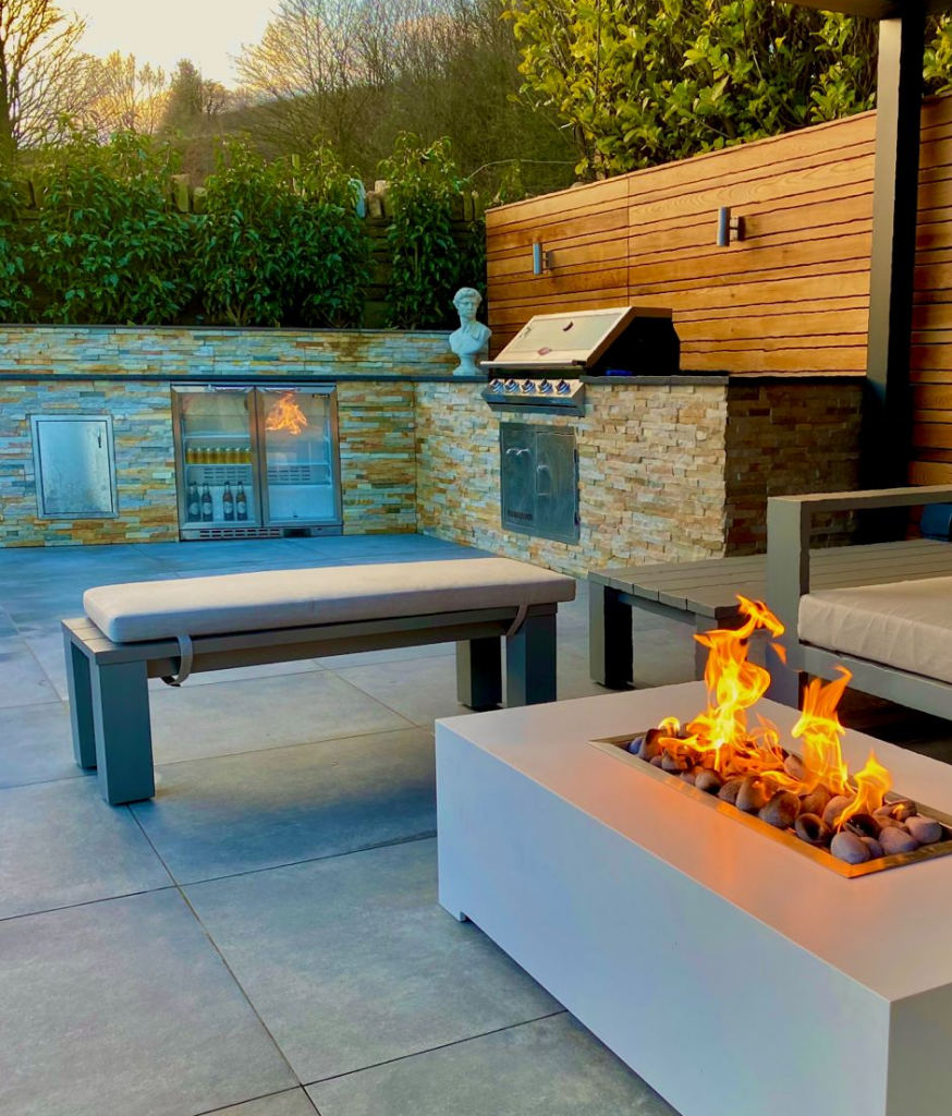 Outdoor kitchen and firepit installed by Landscape by Design Rochdale